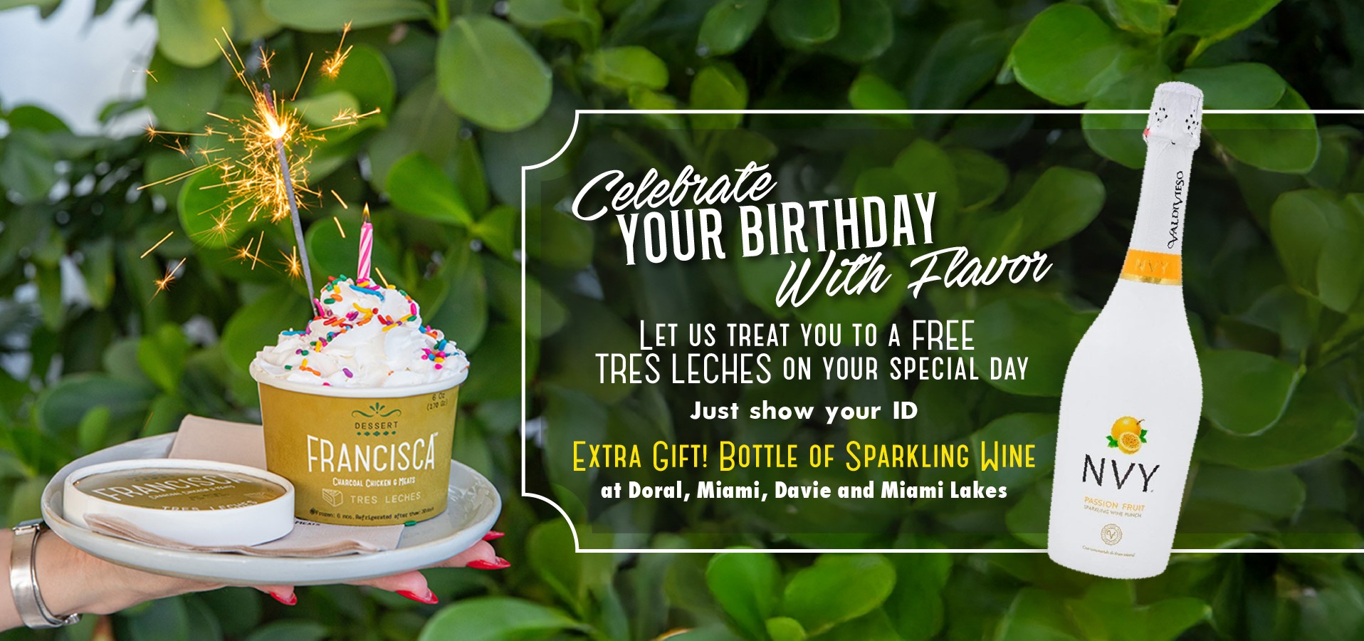 A hand holds a tray with a cup of tres leches topped with whipped cream, sprinkles, a candle and a lit sparkler, with green leaves in the background. On the right, a bottle of NVY sparkling wine appears alongside text promoting a free birthday tres leches and complimentary sparkling wine at Francisca restaurants.
