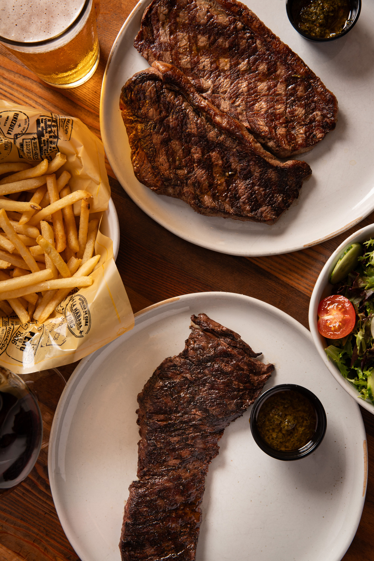Image of meat served on a plate with French fries